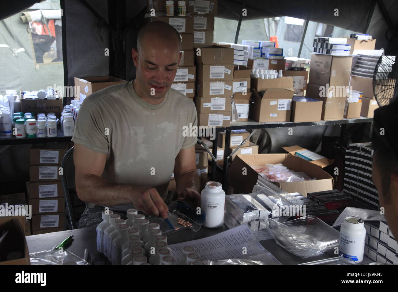 U.S. Air Force Tech Sgt. Bryan Kopco, with the 96th Medical Support Group, from Eglin Air Force Base, Florida, fills prescription bags at a medical readiness event during in Dangriga, Belize, May 22, 2017. This is the third and final medical event scheduled for Beyond the Horizon 2017, a U.S. Southern Command-sponsored, Army South-led exercise designed to provide humanitarian and engineering services to communities in need, demonstrating U.S. support for Belize. (U.S. Army photo by Spc. Kelson Brooks) (RELEASED) Stock Photo