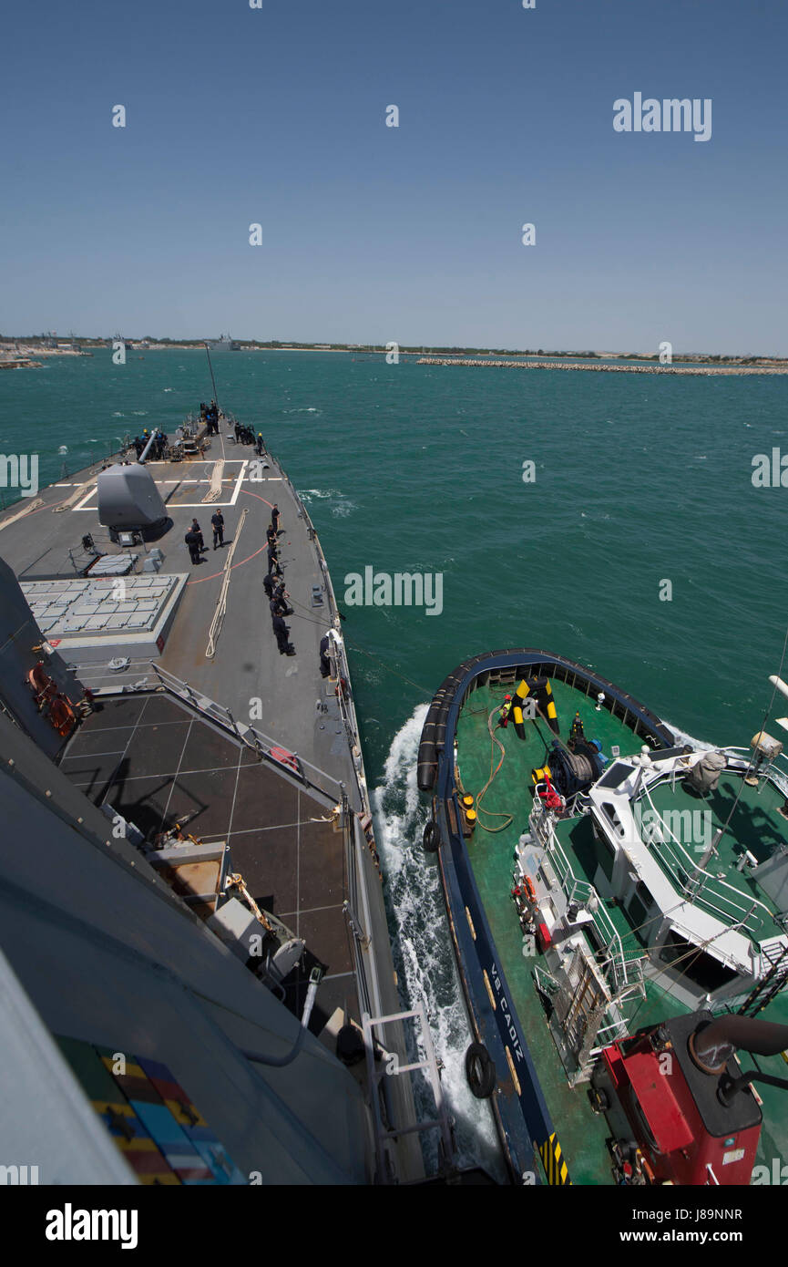 The Arleigh Burke-class guided-missile destroyer USS Carney is guided ...