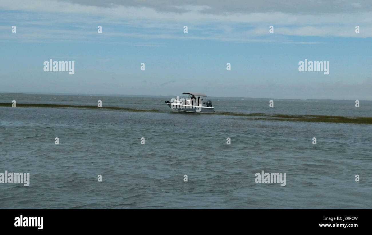 A recreational fishing boat is aground near Wachapreague, Va., May 25