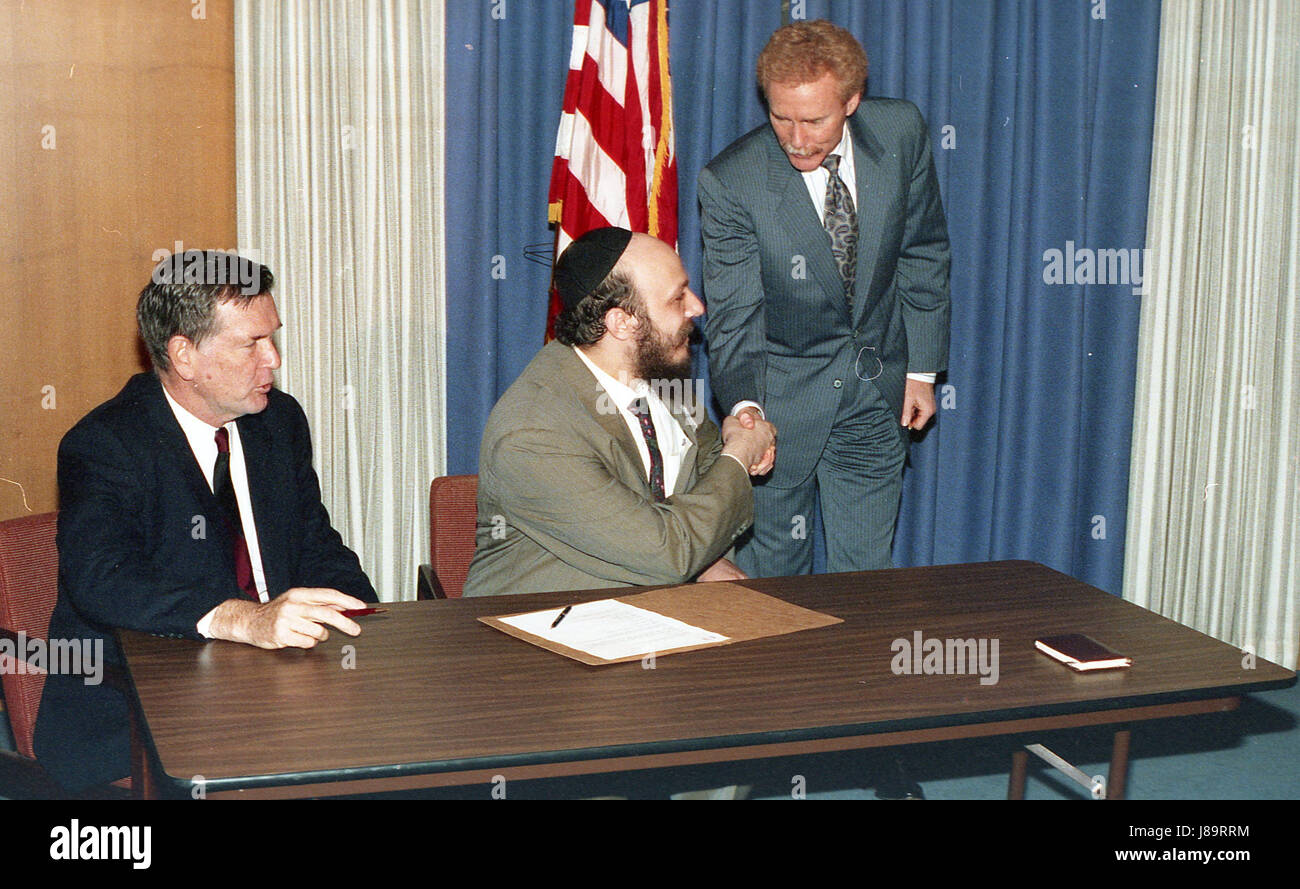 men shaking hands and talking Stock Photo Alamy