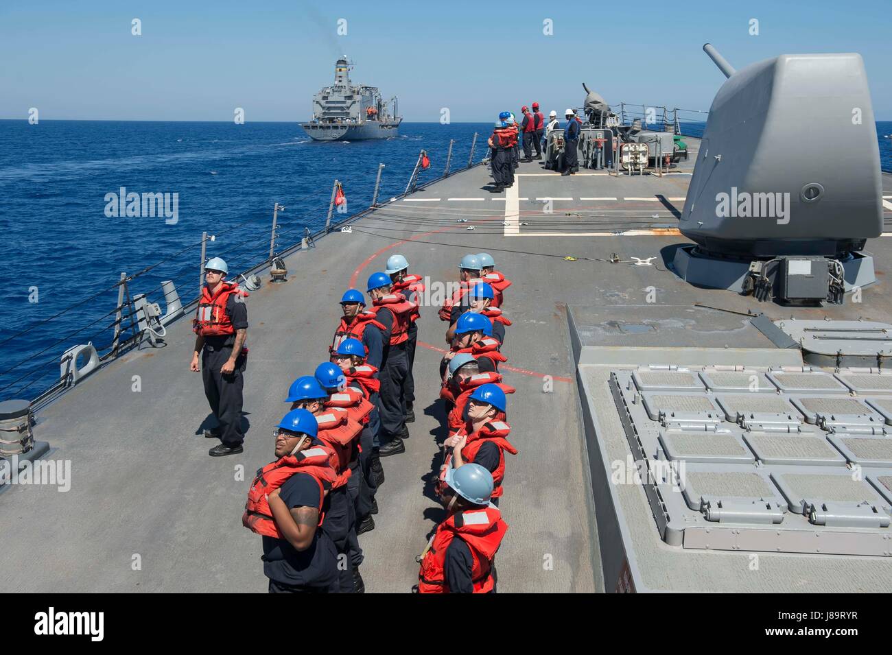 The Arleigh Burke-class destroyer USS Ross (DDG 71) conducts naval ...