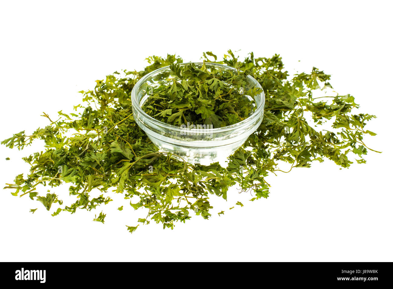 Dried parsley on white background Stock Photo Alamy