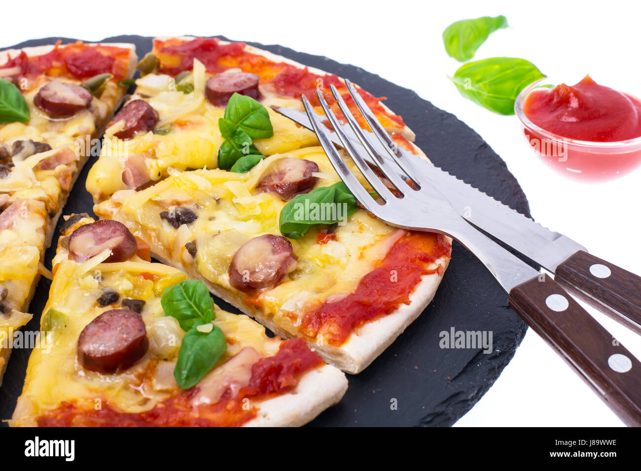 Homemade pizza on black stone plate Stock Photo Alamy