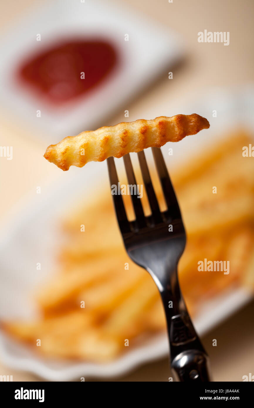 fries on a fork Stock Photo Alamy