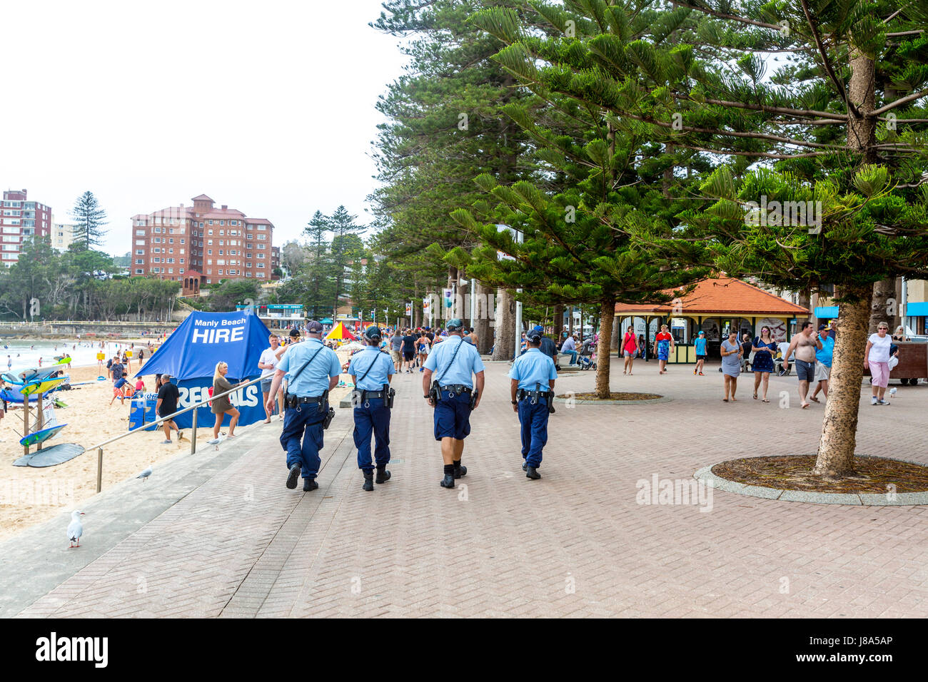 Sydney New south wales police officers team of four 4 on patrol at Manly Beach,Sydney,Australia Stock Photo