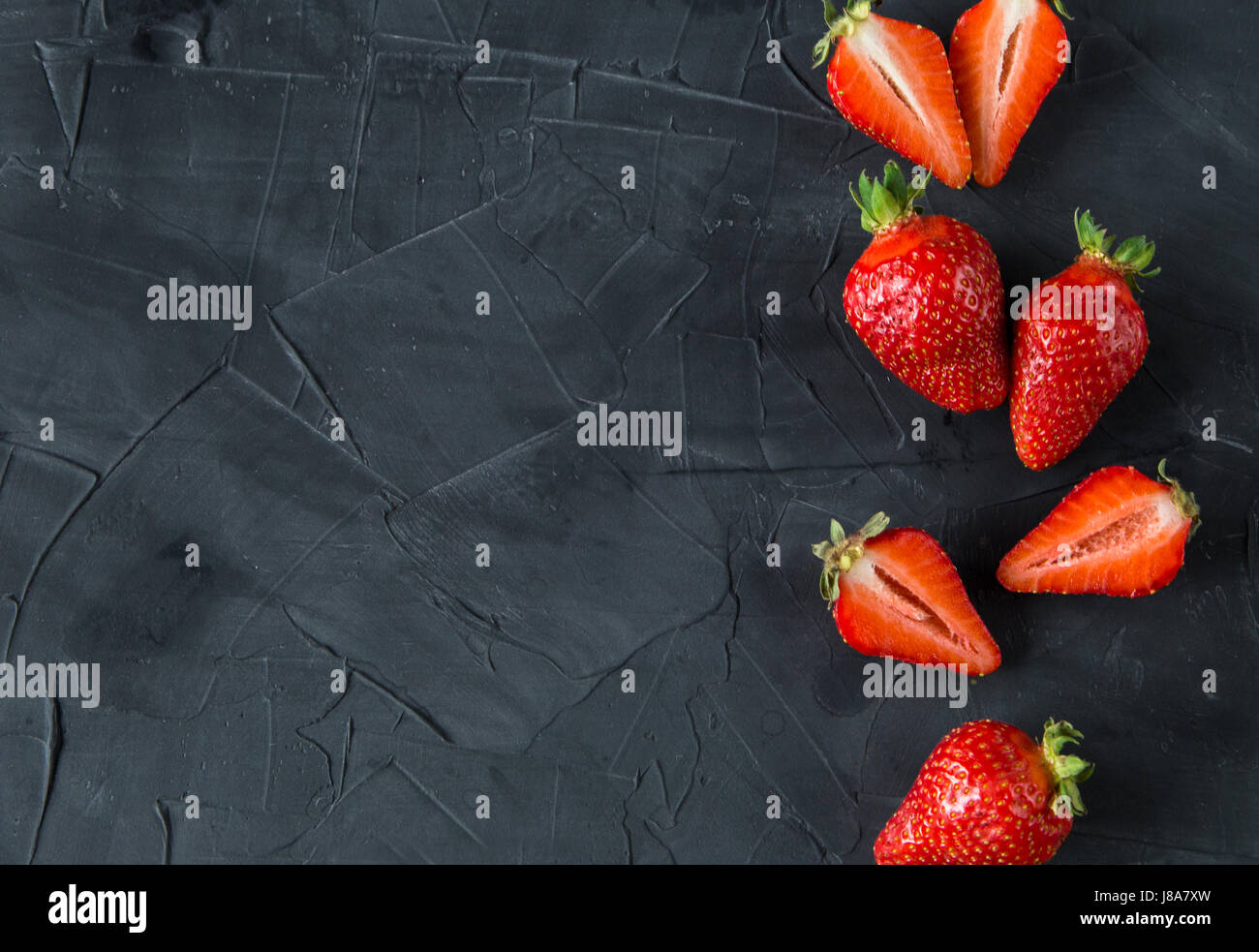 Fresh strawberries on concrete background Stock Photo - Alamy