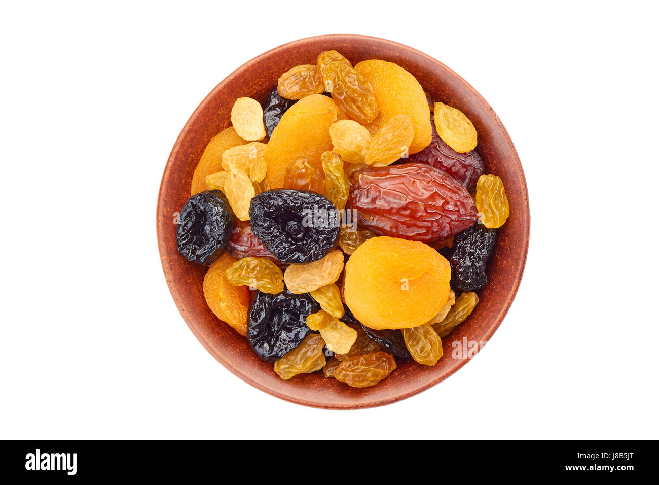 Bowl of dried fruits mix on white Stock Photo