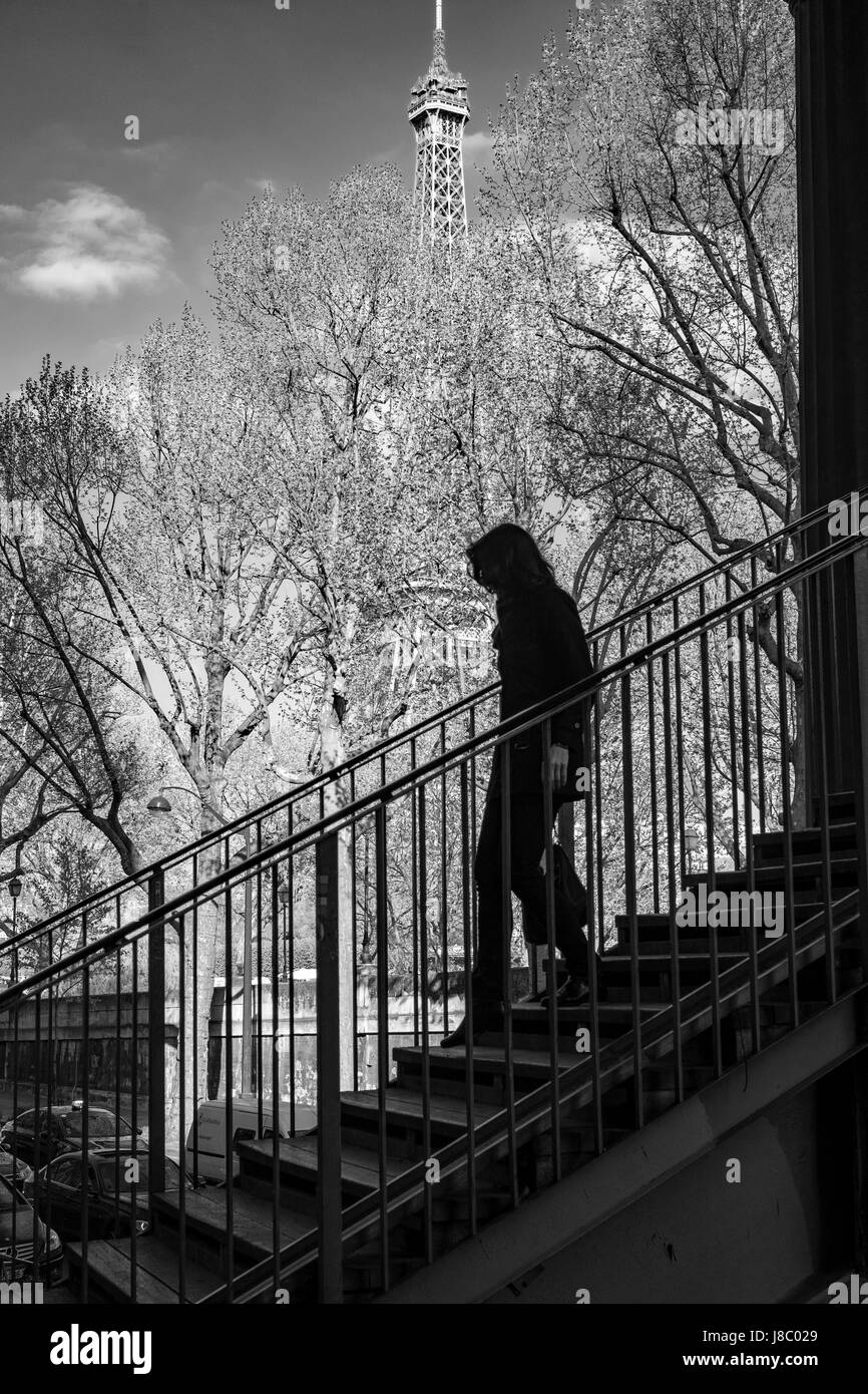 Silhouette of a woman on stairs Stock Photo