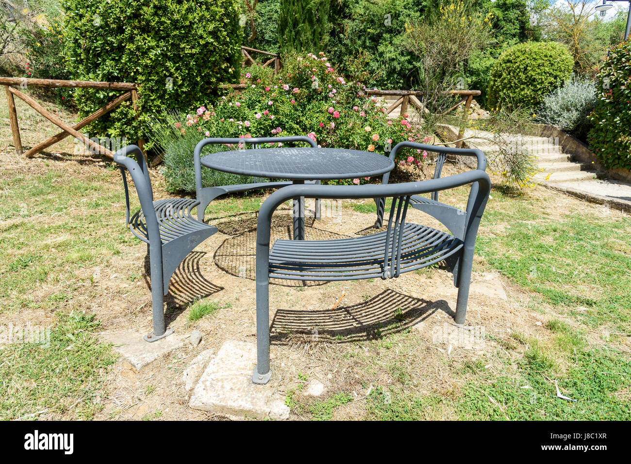 iron table and chairs in the garden Stock Photo