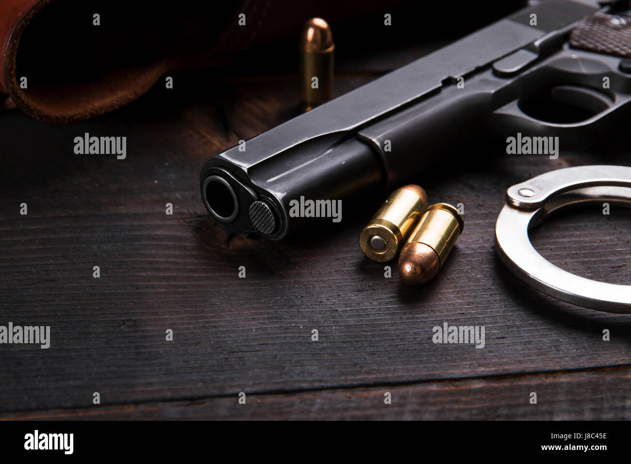 Gun Colt with bullets and holster rests Stock Photo
