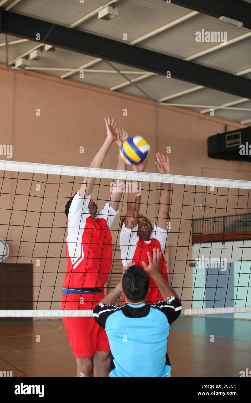 Boys playing volleyball inside hi-res stock photography and images - Alamy