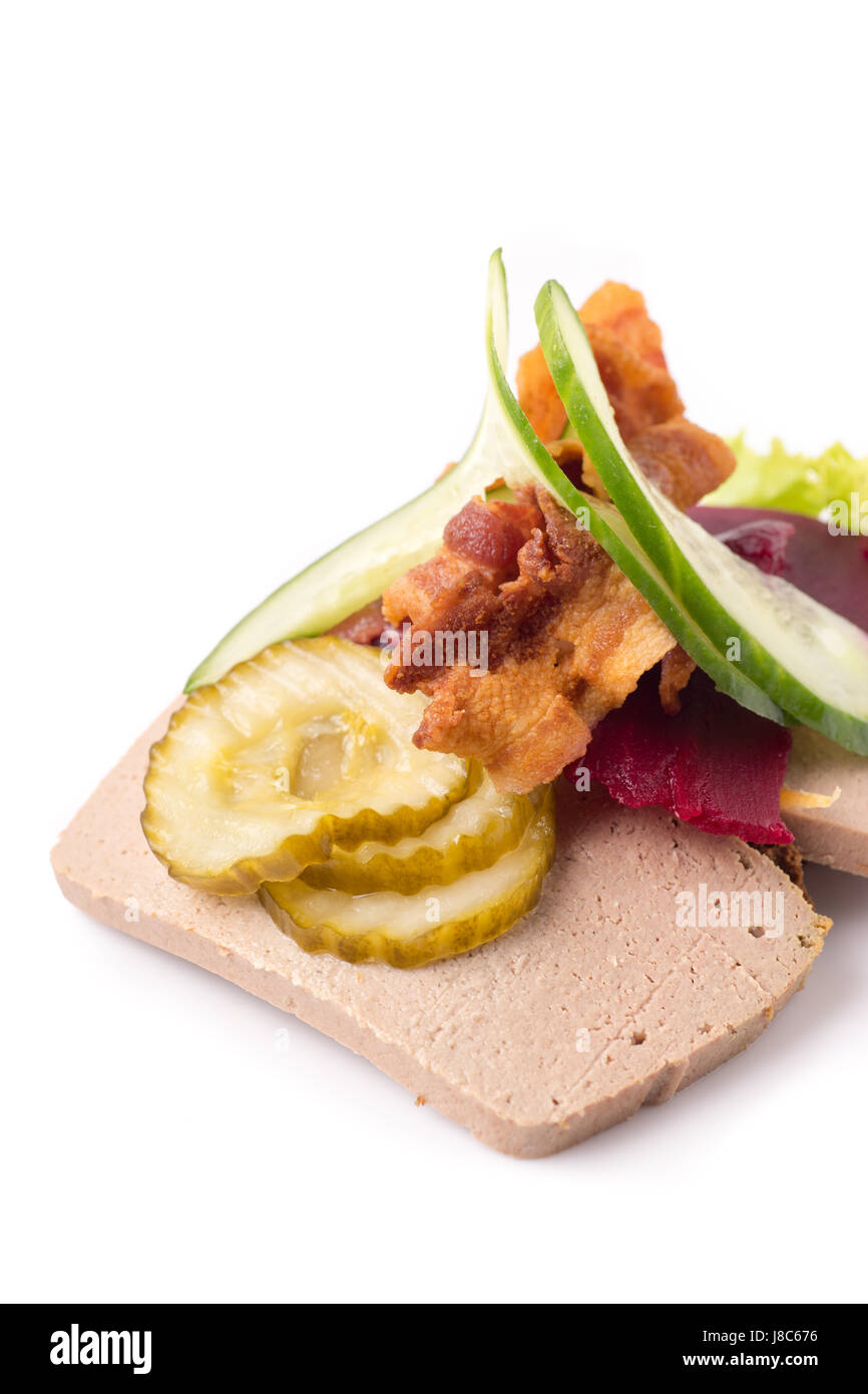 Danish specialties and national dishes, high-quality open sandwich, Liver Pate with bacon pickled cucumber, beetroot and cucumber isolated on white ba Stock Photo