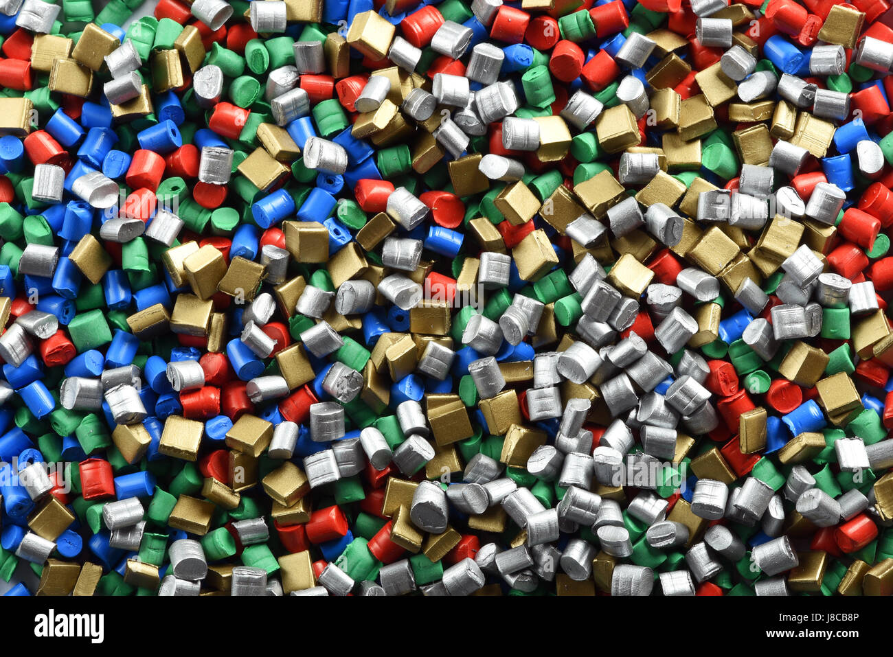 Background texture of multicolored plastic pellets or granules made