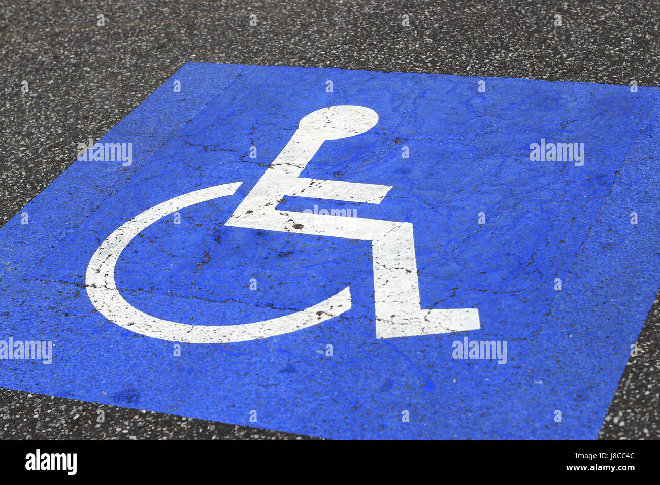 Painted Disable Parking sign on Asphalt Stock Photo