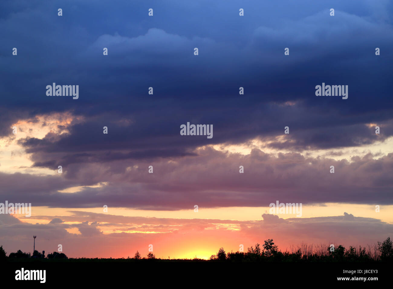 Beautiful sunset on a background of clouds in the sky Stock Photo - Alamy