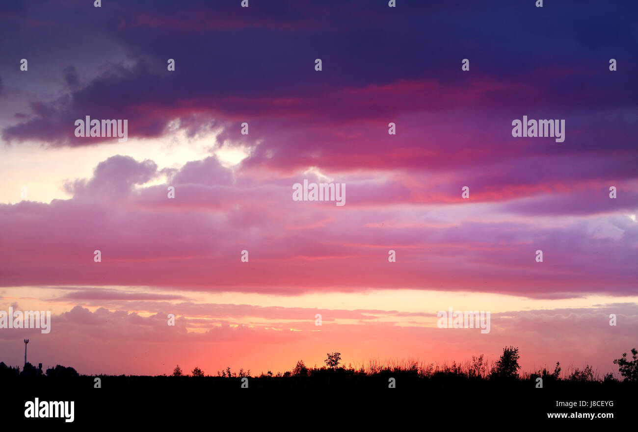 Beautiful sunset on a background of clouds in the sky Stock Photo - Alamy
