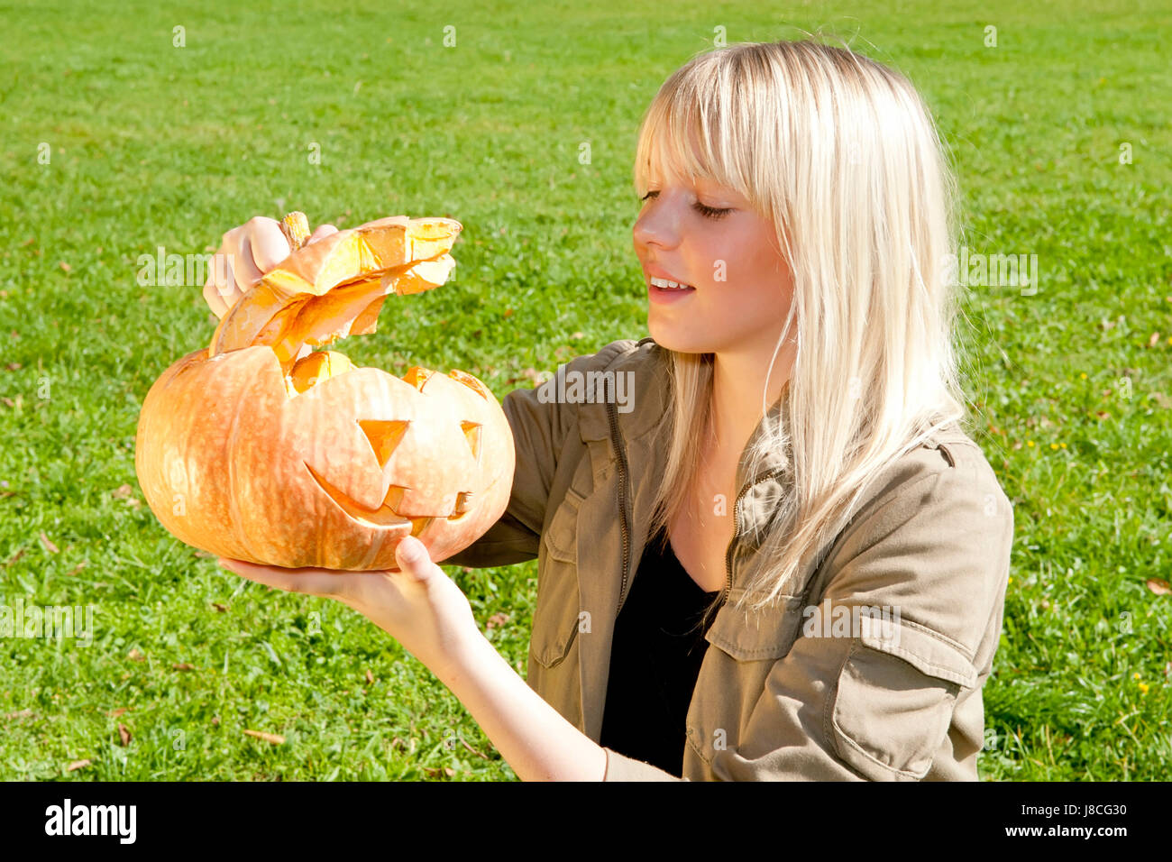 young woman with halloween pumpkin Stock Photo