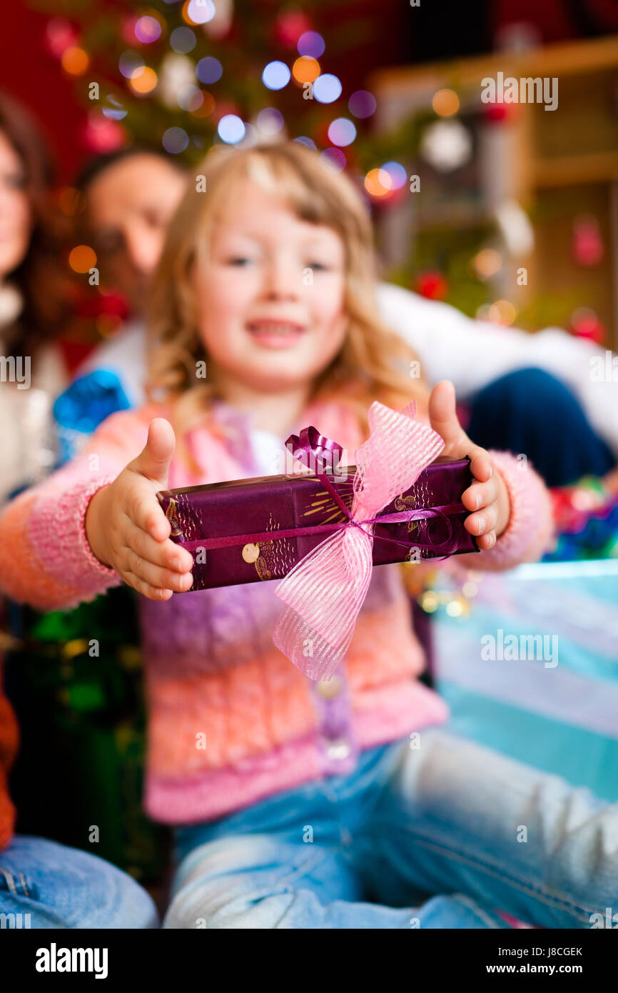 christmas family with gifts on christmas eve Stock Photo Alamy