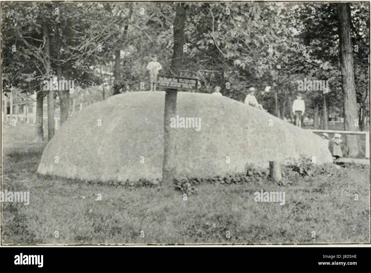 The granite bowlder at Nora Springs, Iowa, is a geological feature with significance to local history. It highlights the natural landscape and the geological processes in Iowa's history. Stock Photo