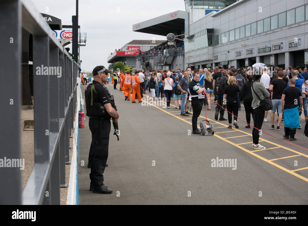 Donington Park, UK. 28th May, 2017. Armed police patrolling the pit lane after terror attacks in Manchester UK Credit: steven roe/Alamy Live News Stock Photo