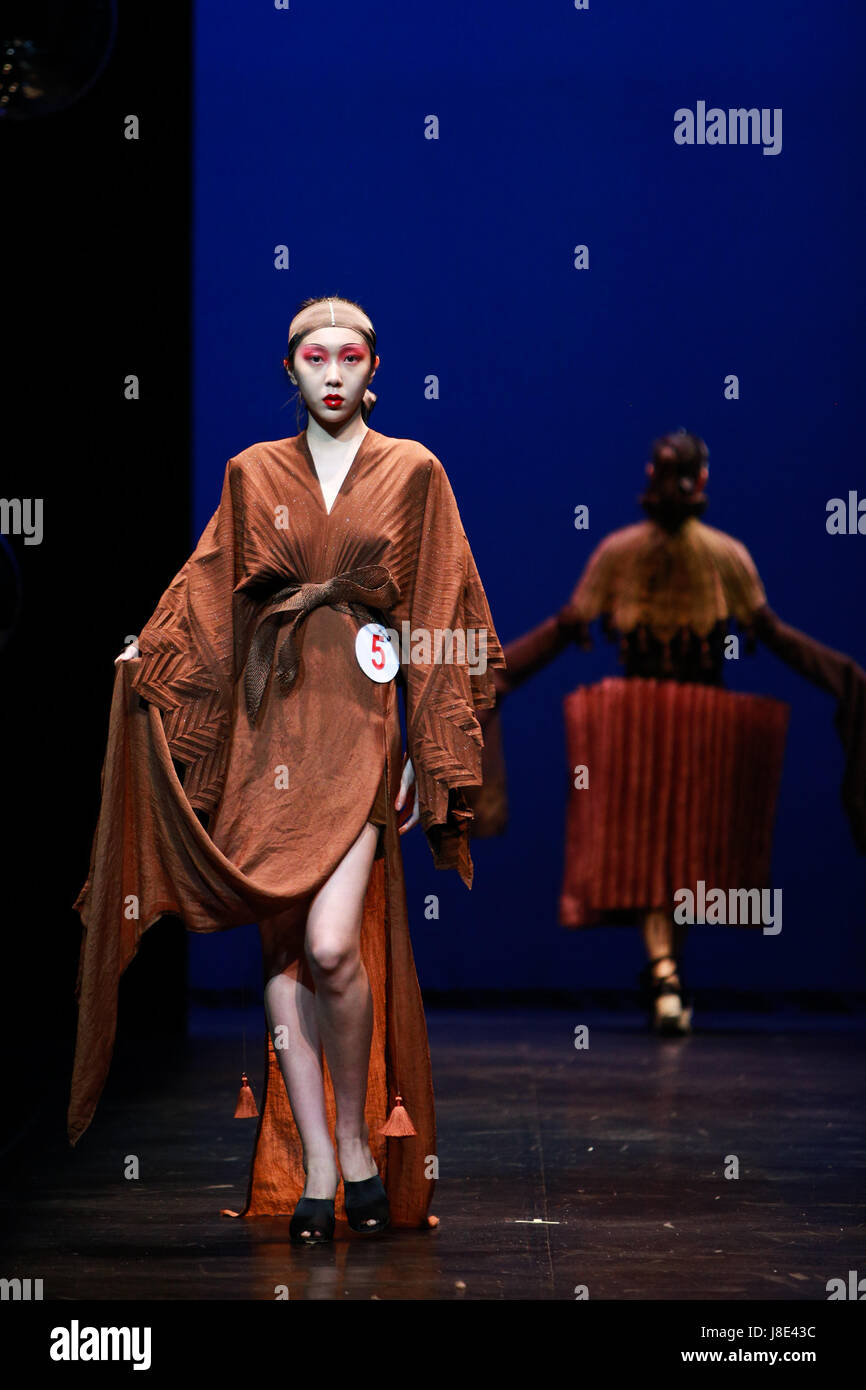 Beijing, China. 28th May, 2017. Models display creations during the final performance of the 4th Beijing figurative design competition of college students at the Central Academy of Drama in Beijing, capital of China, May 28, 2017. The competition was held every two years since 2011 and it has become an important competition for university students of art design. Credit: Xin Yuewei/Xinhua/Alamy Live News Stock Photo