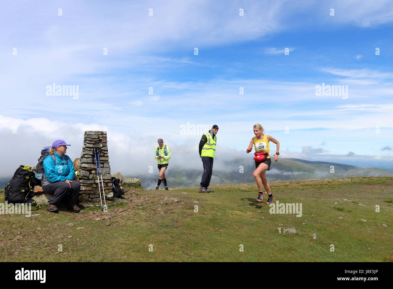 Clough Head, Lake District, Cumbria, UK. 28th May, 2017. UK Weather. Despite a cloudy start to the day, fell runners taking part in the Helvellyn and the Dodds Fell Race had sunshine as they passed over the 726m high summit of Clough Head. Credit: David Forster/Alamy Live News Stock Photo