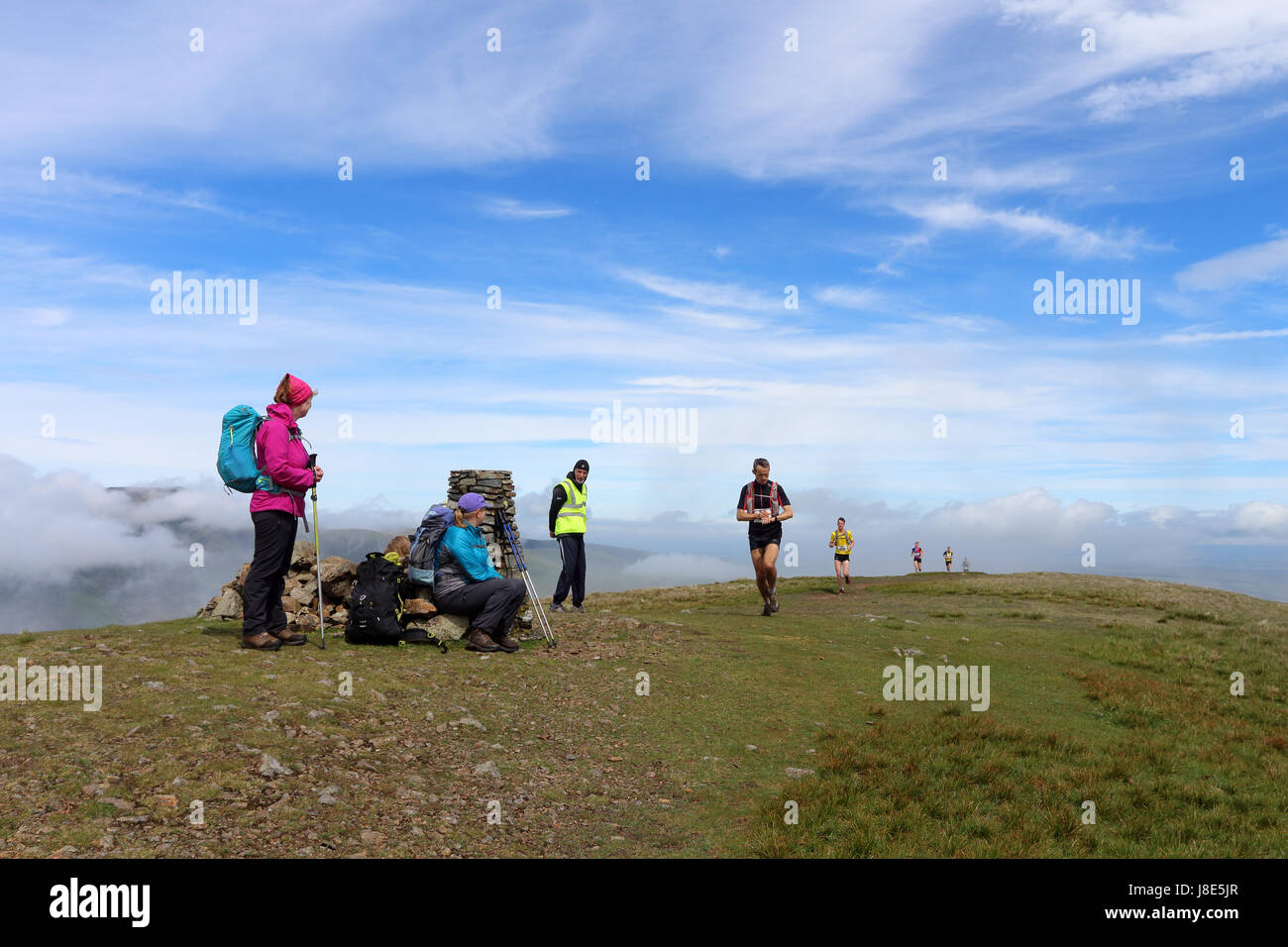 Clough Head, Lake District, Cumbria, UK. 28th May, 2017. UK Weather. Despite a cloudy start to the day, fell runners taking part in the Helvellyn and the Dodds Fell Race had sunshine as they passed over the 726m high summit of Clough Head. Credit: David Forster/Alamy Live News Stock Photo