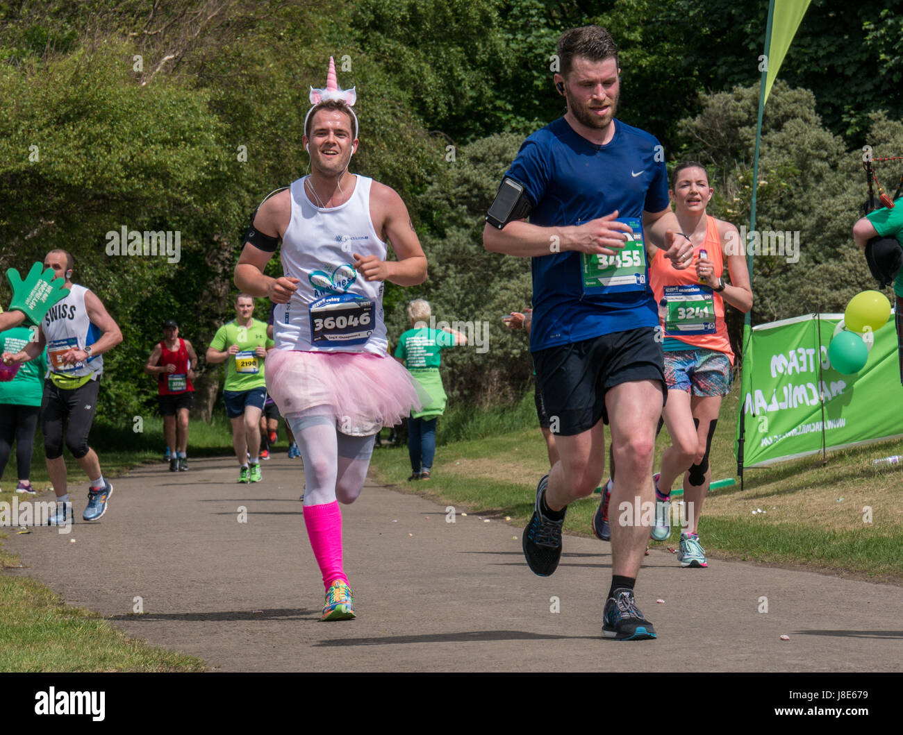 Gosford Estate,  East Lothian, Scotland, UK. 28th May, 2017. A smiling man in fancy dress with a tutu and pink socks in Edinburgh Marathon Festival 2017 in Gosford Estate at Mile 18 Stock Photo