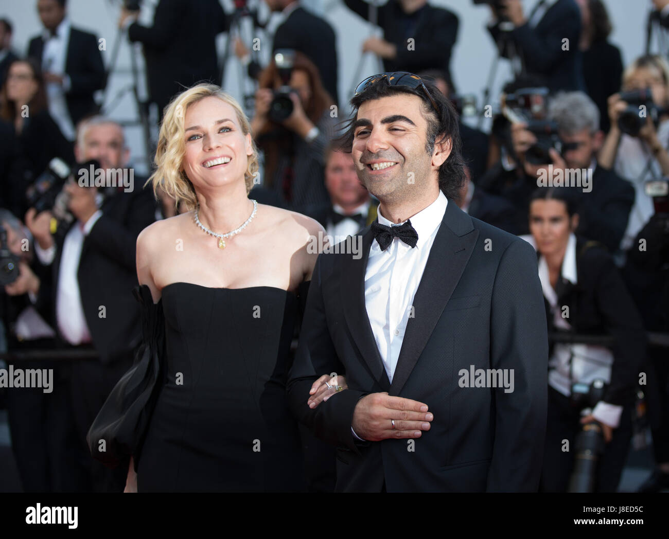 Cannes, France. 28th May, 2017. Actress Diane Kruger, winner of the Best Actress Award for the film 'In The Fade', poses with director Fatih Akin on the red carpet of the closing ceremony of the 70th Cannes Film Festival in Cannes, France, May 28, 2017. Credit: Xu Jinquan/Xinhua/Alamy Live News Stock Photo