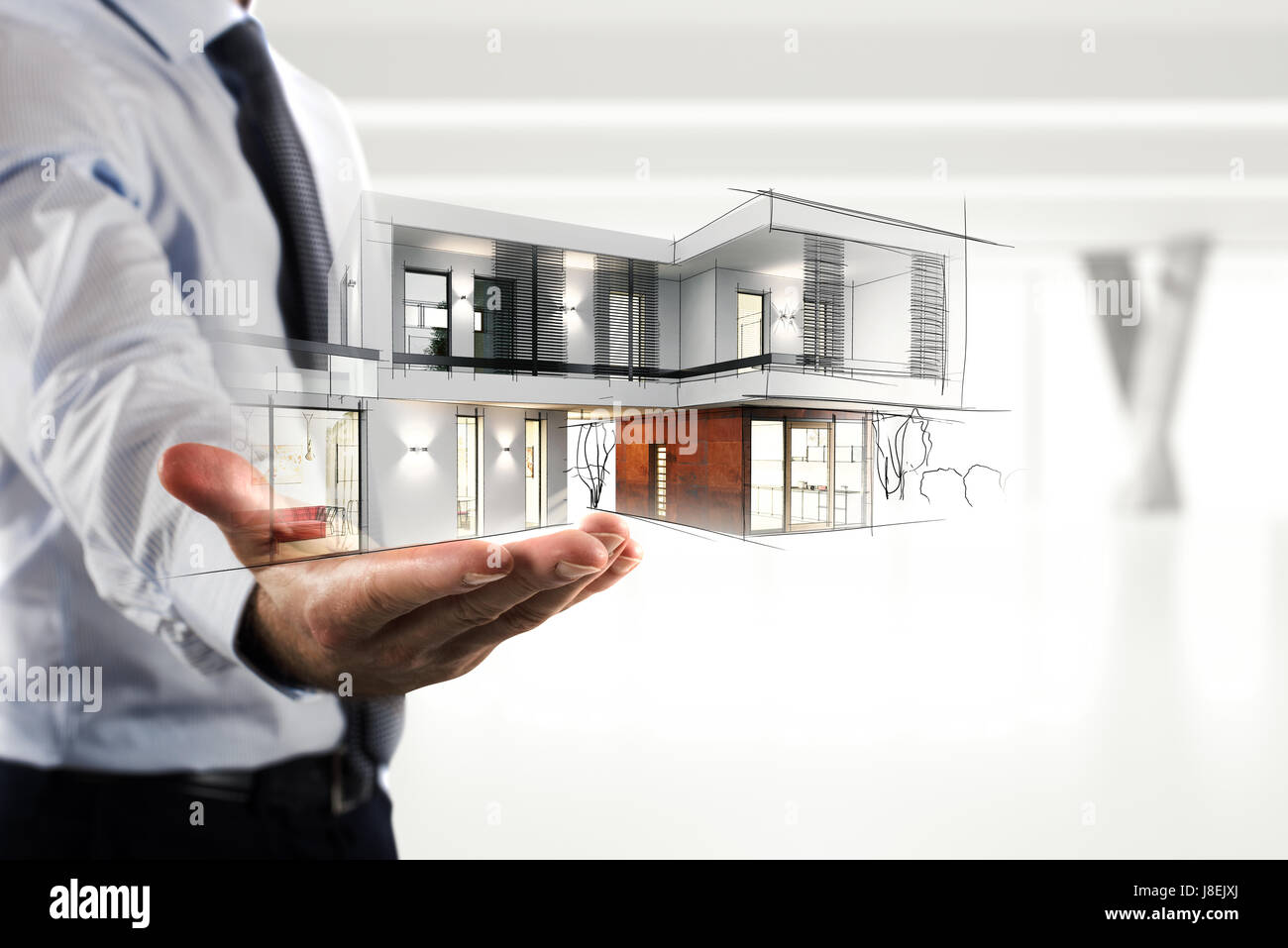 Businessman showing a modern office project Stock Photo
