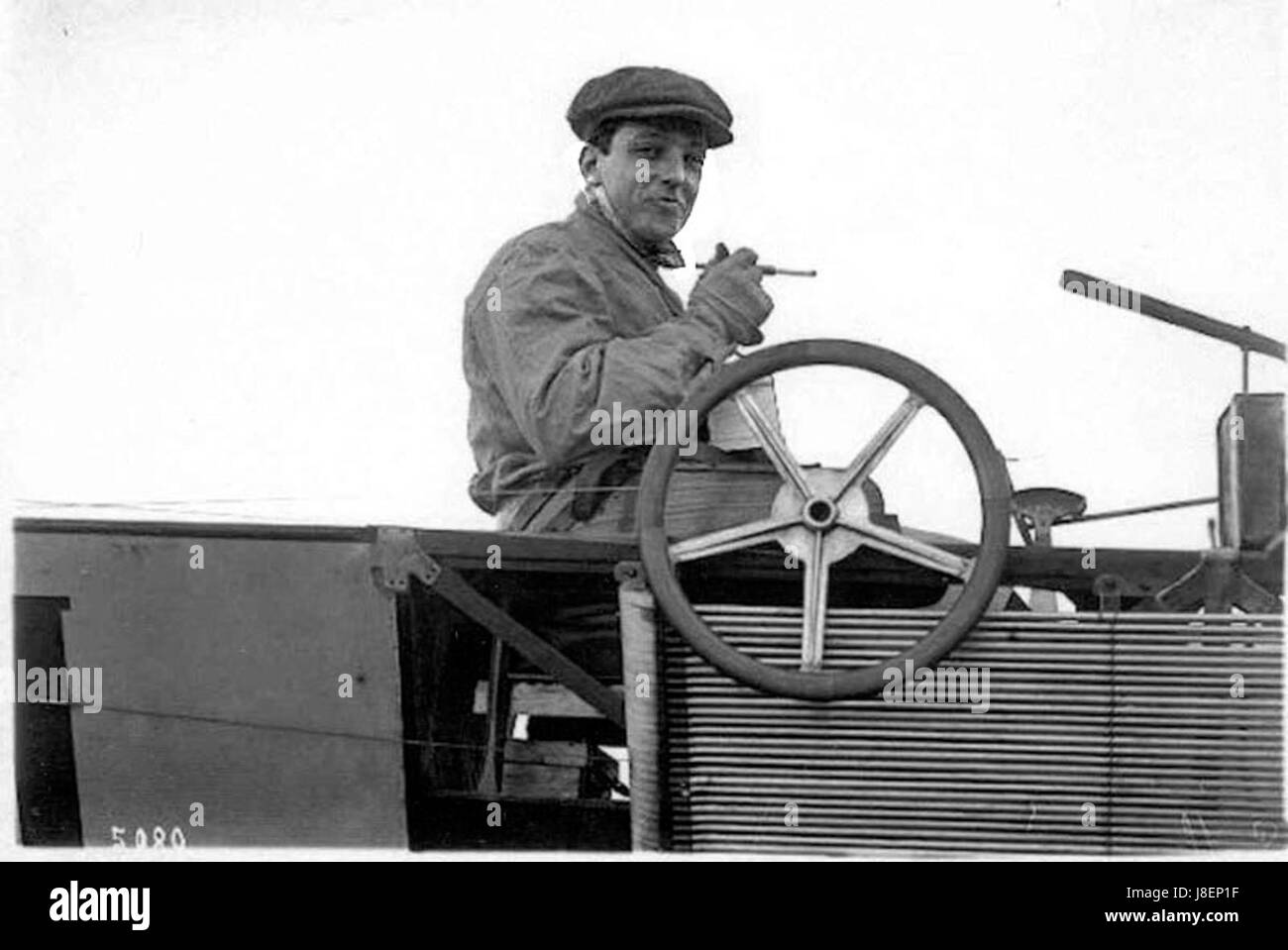 Latham with his cigarette and ivory holder at the controls of an Antoinette VII v2 Stock Photo