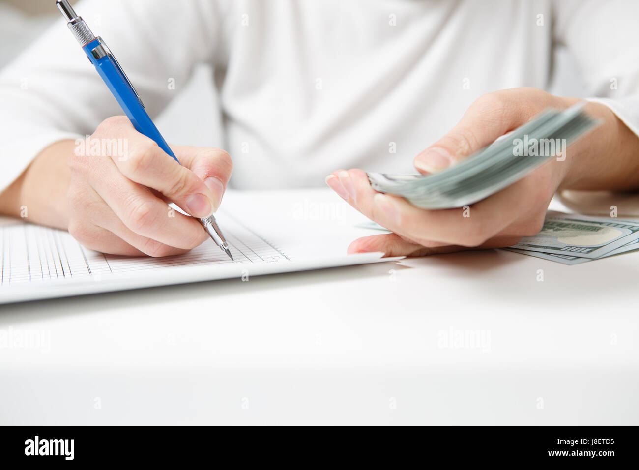 Entrepreneur calculating and reviewing investment plan Stock Photo - Alamy