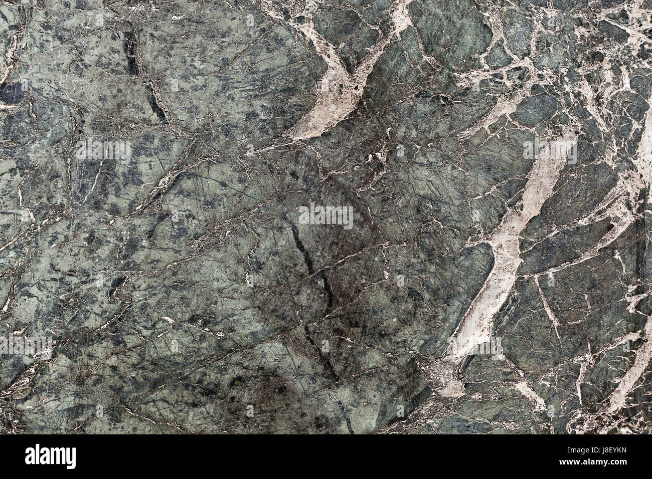 Dark green marble tile texture background with white and black cracks