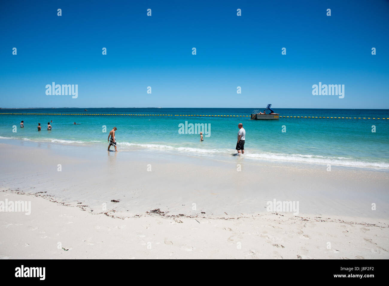 Coogee,WA,Australia-November 14,2016: Tourists swimming in the Indian Ocean with pontoon at Coogee Beach in Coogee, Western Australia Stock Photo