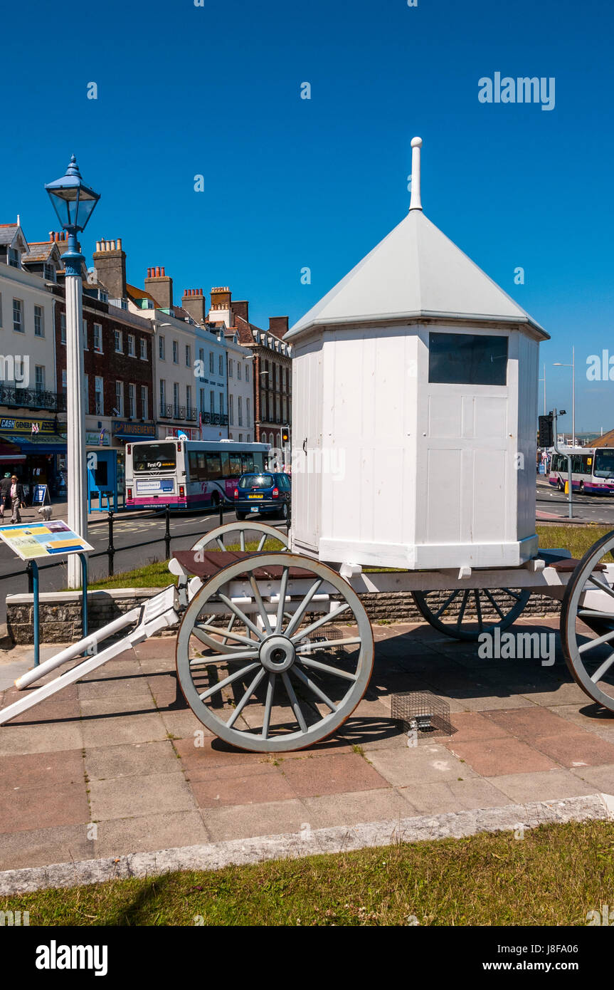 Full size replica of George lll's bathing machine on Weymouth seafront which enabled him to change inside the carriage as it was wheeled into the sea Stock Photo