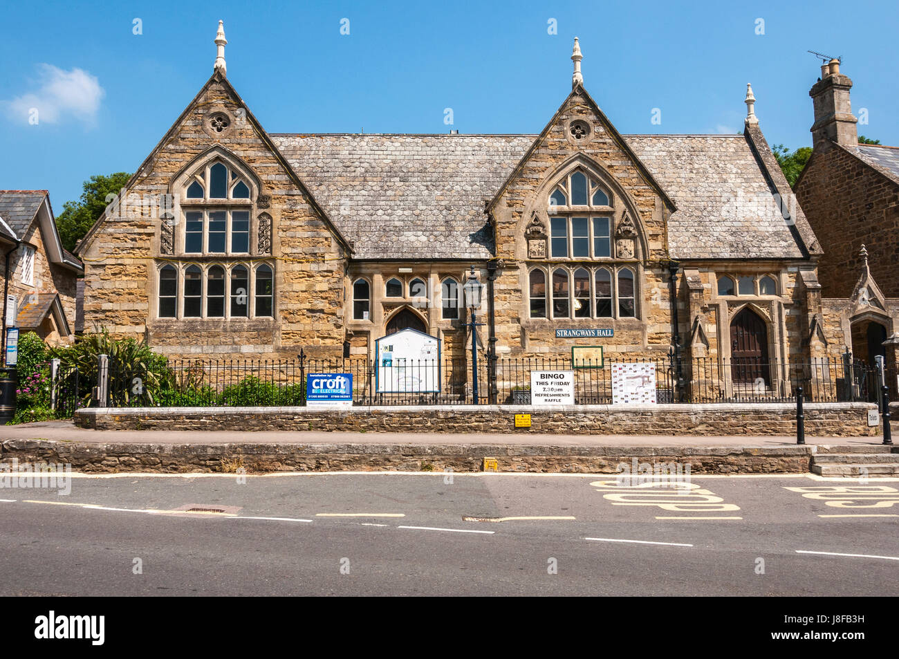 A handsome picturesque and substantial old village school now used as the village hall, grade ll listed it is situated in the centre jof Abbotsbury Stock Photo