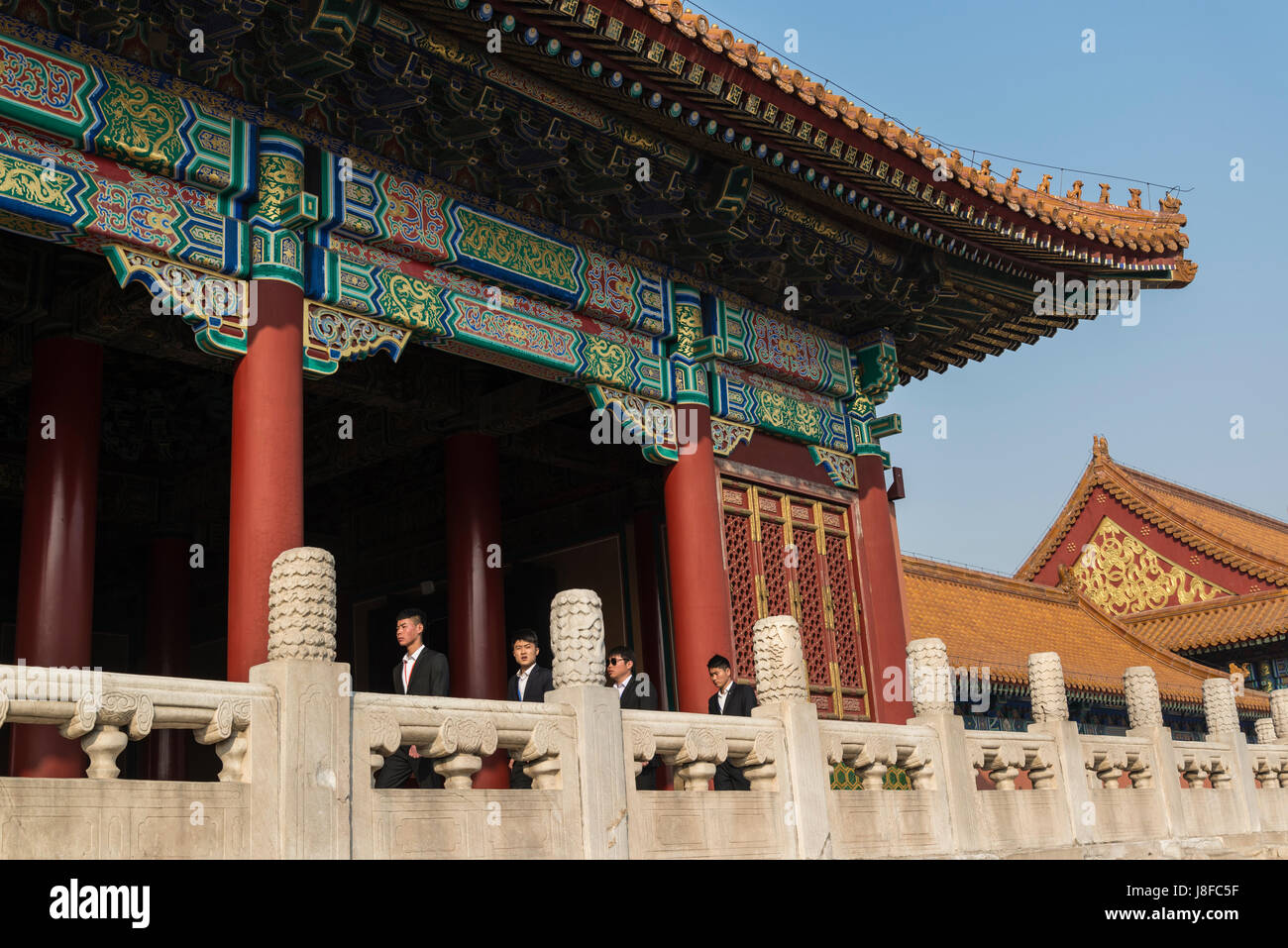 Guardians in civilian clothes, Gate of Supreme harmony, Forbidden City, Chinese imperial palace, Beijing, China Stock Photo