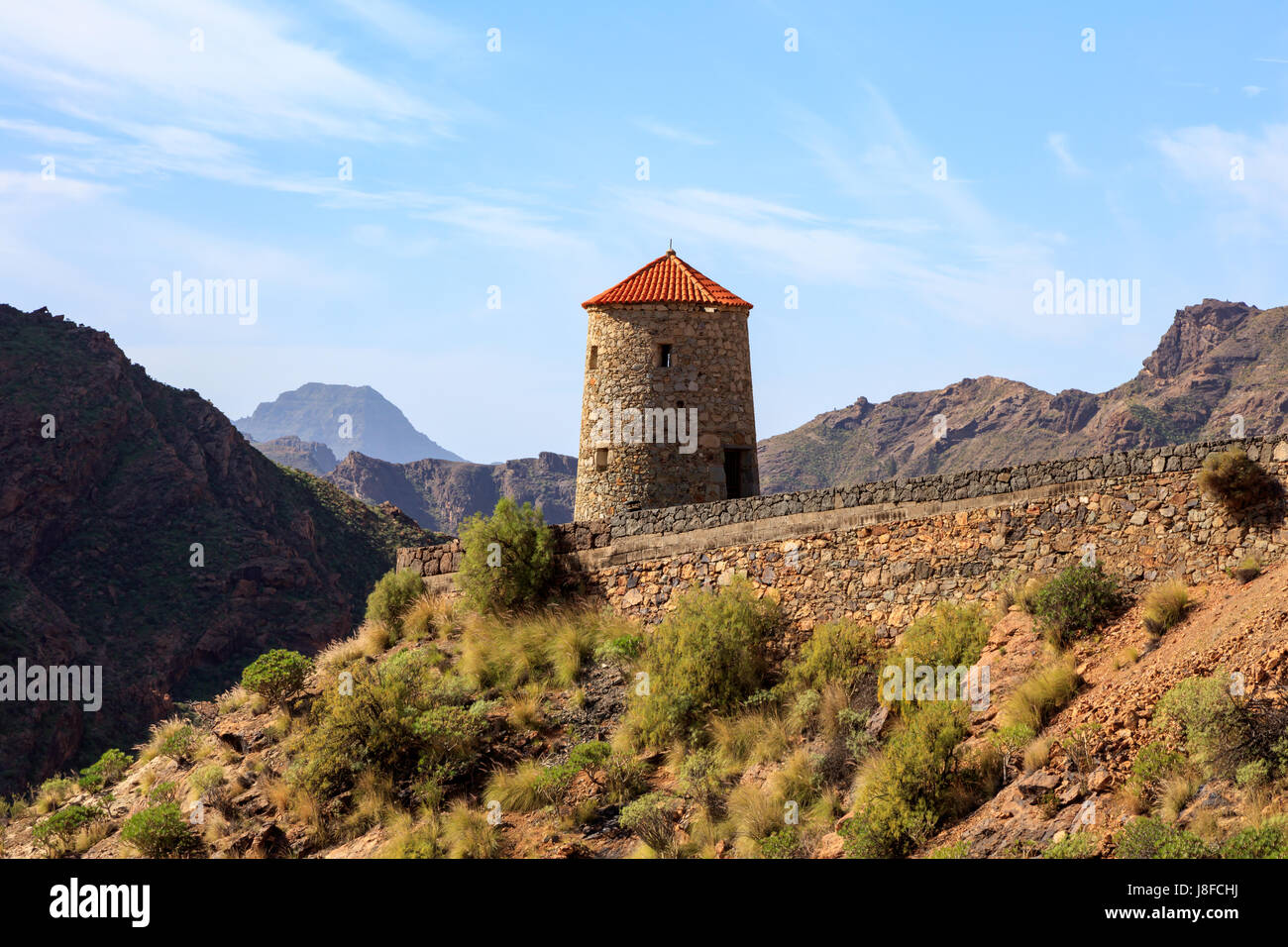 Old windmill in the mountains of Gran Canaria, near Presa del Parralillo,Spain Stock Photo