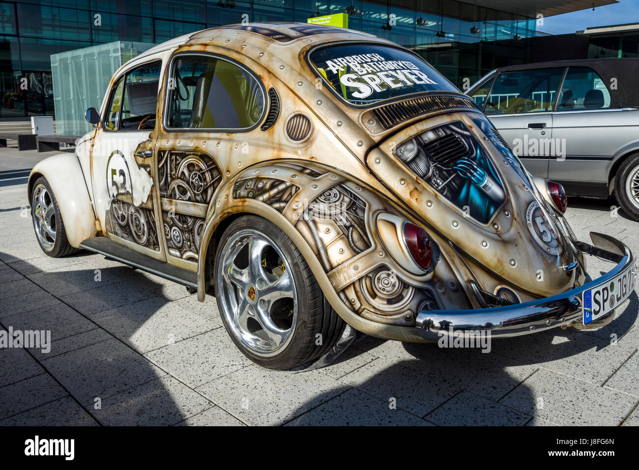 Compact car Volkswagen Beetle in unusual body painting (aerography). Rear view. Europe's greatest classic car exhibition 'RETRO CLASSICS' Stock Photo