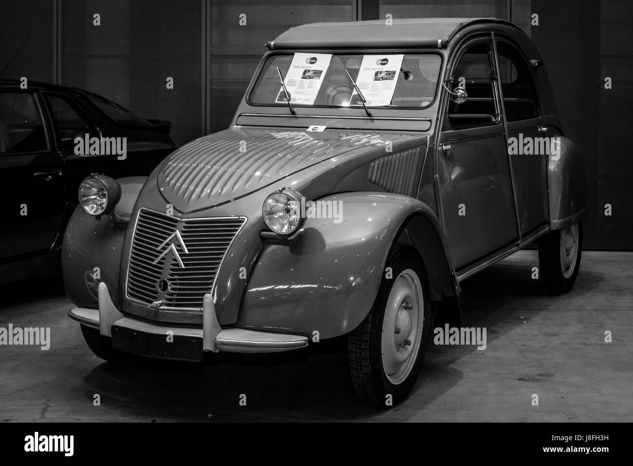 STUTTGART, GERMANY - MARCH 04, 2017: Economy car Citroen 2CV-AZ, 1956. Black and white. Europe's greatest classic car exhibition 'RETRO CLASSICS' Stock Photo