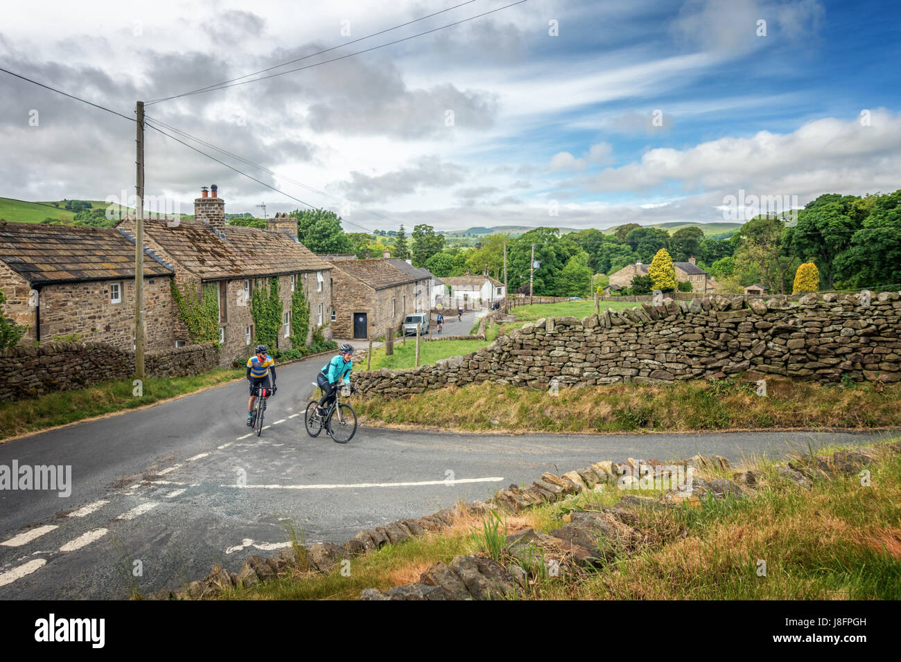 The quaint and rural Beamsley village and a popular Yorkshire lane with cyclists, Wharfedale, England Stock Photo