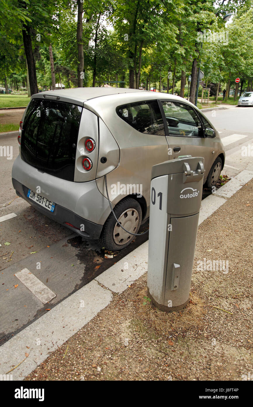 autolib, electric car charging on a Paris street. Rental car service. Paris street. Stock Photo