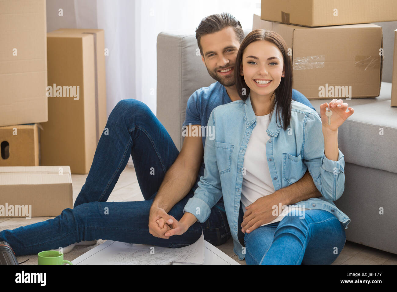 Young couple moving to a new apartment together relocation Stock Photo ...