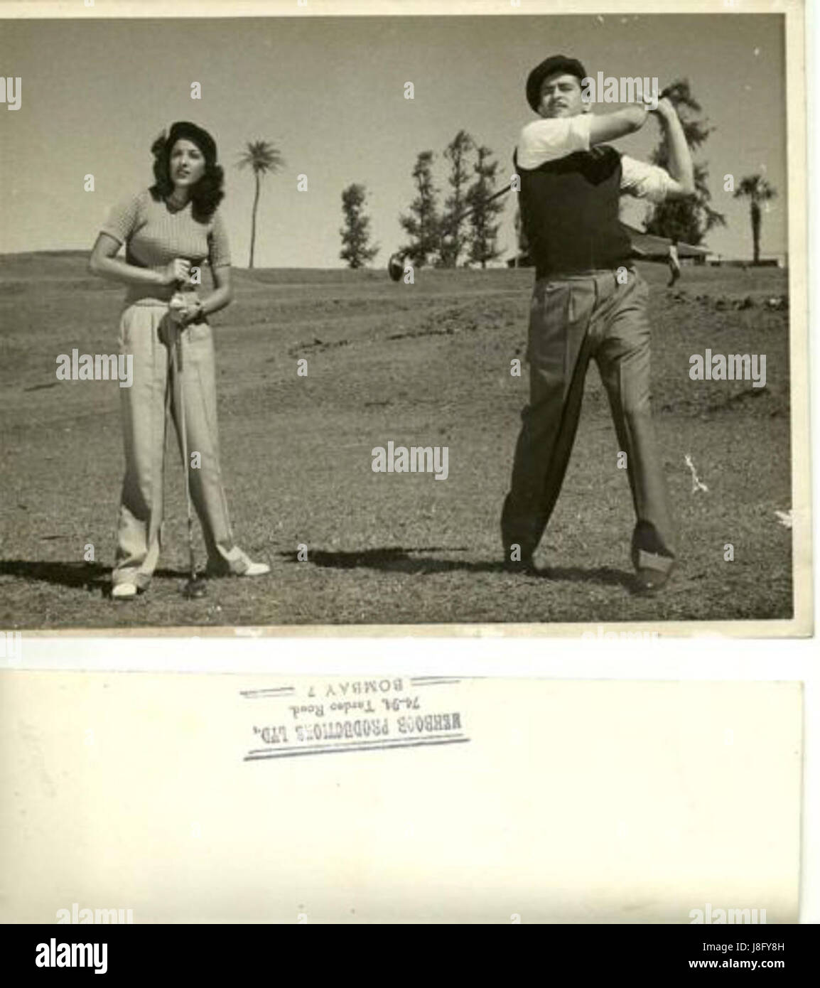 Hindi film stars Nargis and Raj Kapoor playing golf Stock Photo