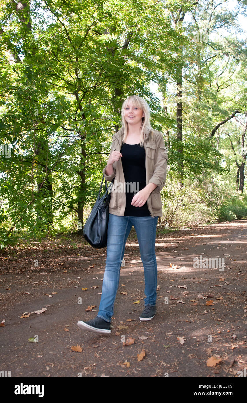 young woman walking in park Stock Photo - Alamy