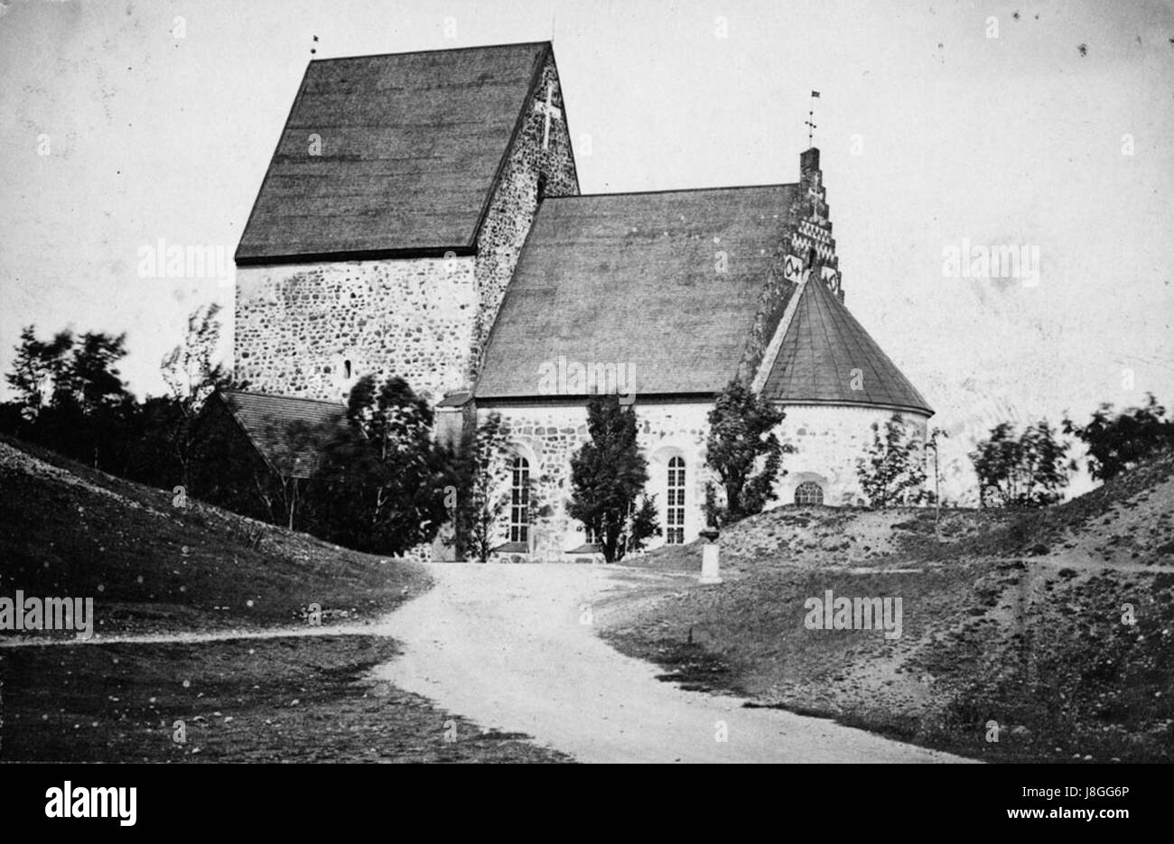 Gamla Uppsala Church, located in the historical site of Gamla Uppsala, Sweden, is an important landmark with significant religious and cultural history. The church is associated with Viking-era burial mounds and historical Swedish royalty. Stock Photo