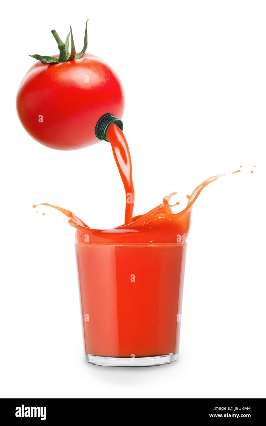 tomato juice pouring from fresh tomato into glass with splashes