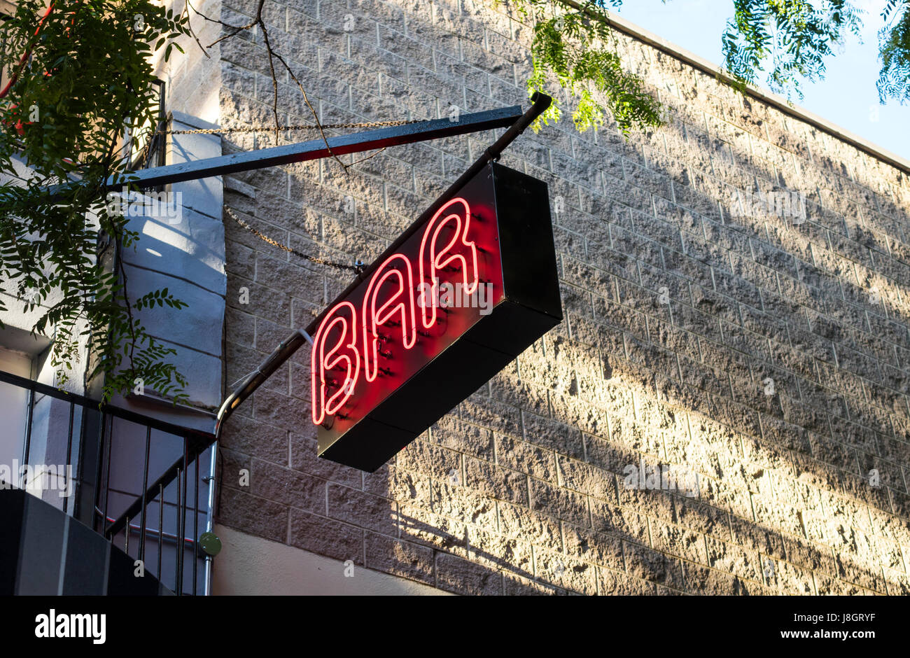 Hanging neon bar sign in New York City Stock Photo Alamy