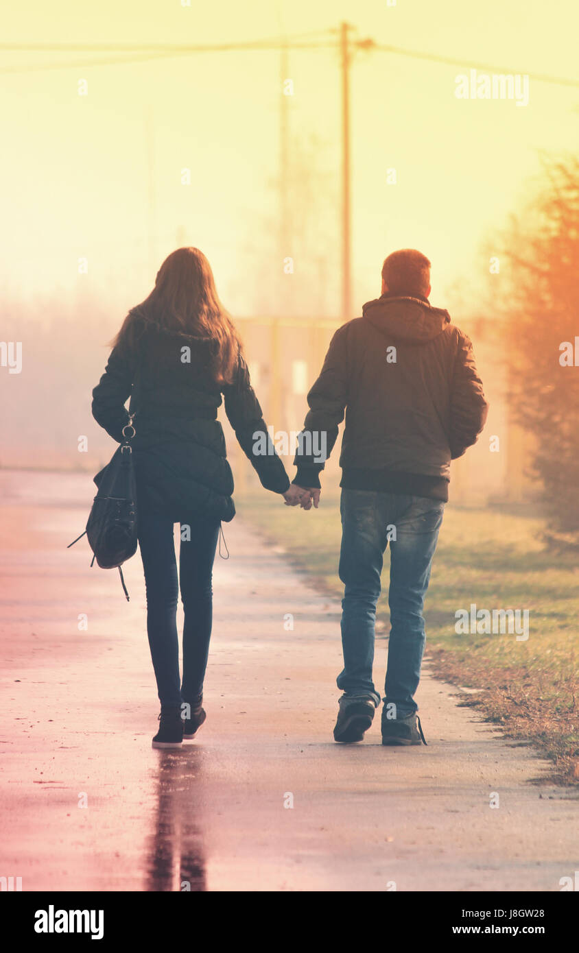 Girl guy holding hands walking hi-res stock photography and images - Alamy