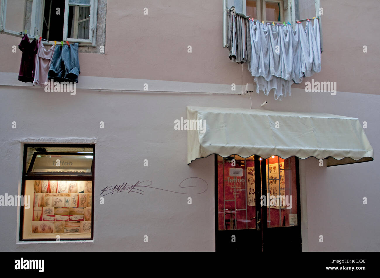 Laundry hanging above a tatoo shop in Zadar Croatia Stock Photo Alamy